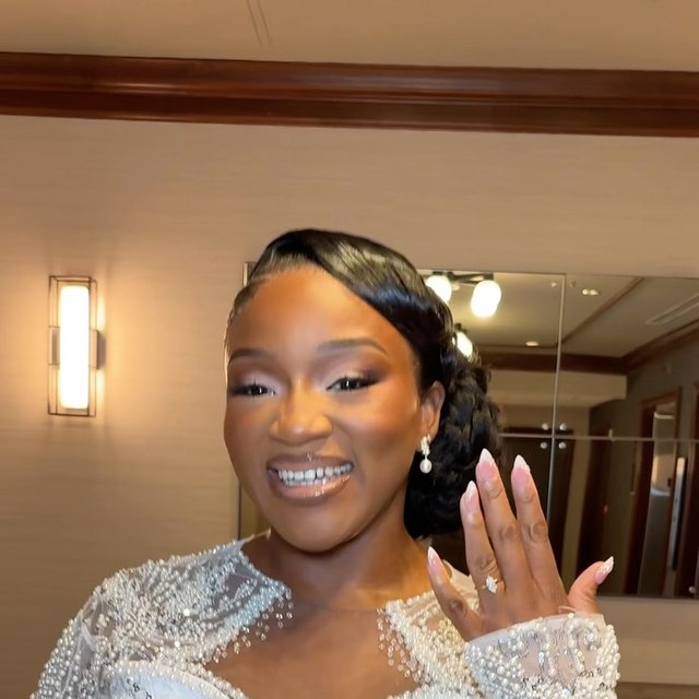 A bride showing her wedding ring after the ceremony