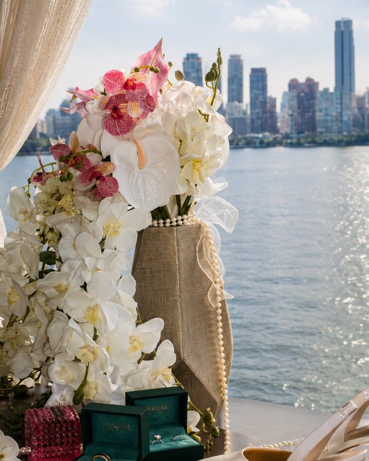 Vow books, perfume, earrings and shoes laid out before the ceremony