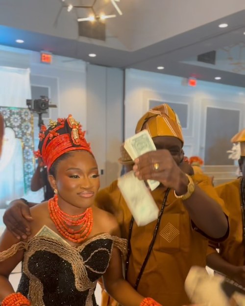 Money sprayed over the couple during the traditional ceremony