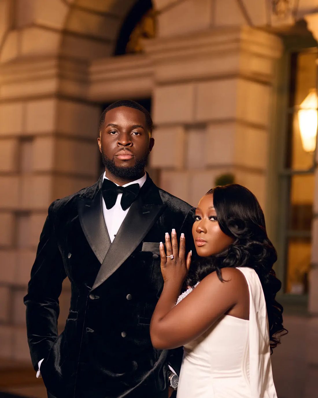A couple photographed in a marble hall
